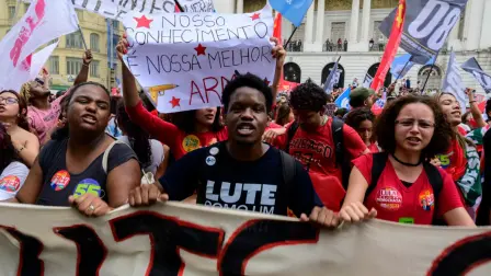 Students backing Brazil's President and presidential candidate Luiz Inacio Lula da Silva in the runoff election take part in a march against the far right in Rio de Janeiro, Brazil on October 7, 2026. Lula da Silva, who has risen from the political ashes several times, is heading to a runoff election against right-wing senator Flavio Bolsonaro on October 25, after a shock second-place finish in the first-round vote. (Photo by Pablo PORCIUNCULA / AFP)