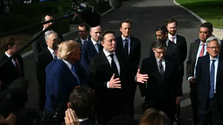 US President Donald Trump listens to SpaceX CEO Elon Musk  speak to the press after a meeting of technology executives about artificial intelligence at the White House in Washington, DC, on September 29, 2026. The gathering comes quickly after tech giant OpenAI's cancellation of the release of its newest model due to safety concerns, and a series of revelations that the technology had gone rogue. (Photo by Kent NISHIMURA / AFP)