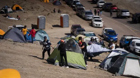 Workers from the Escondida copper mine set camp tents during a strike after failing to reach a labor agreement with Australian group BHP, in Puerto Coloso, Antofagasta, Chile, on August 14, 2024. Workers at the world's largest copper mine in Chile are striking after pay talks fell apart, casting a shadow of uncertainty over the market for the commodity as the Escondida mine digs up around five percent of the world's copper, a coveted metal used in everything from electrical wiring to rechargeable batteries. (Photo by SEBASTIAN ROJAS ROJO / AFP)