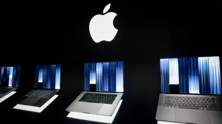 New MacBook Pros with touch screens sit on display at the product's launch in Los Angeles, California, US, October 28, 2026. REUTERS/Evelyn Hockstein