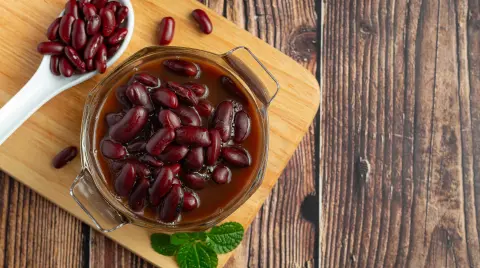 red bean boiled in glass bowl place on wooden cutting board