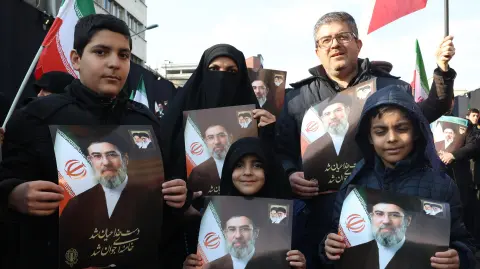 Demonstrators hold pictures of Iran's new Supreme Leader Ayatollah Mojtaba Khamenei as they gather for a rally in support of the new Supreme Leader at Enghelab Square in central Tehran on March 9, 2026. Iran marked the appointment of Ayatollah Mojtaba Khamenei to replace his father as its supreme leader with a new barrage of missiles against Israel and the Gulf states on March 9, as the Middle East war sent oil prices soaring. (Photo by AFP)