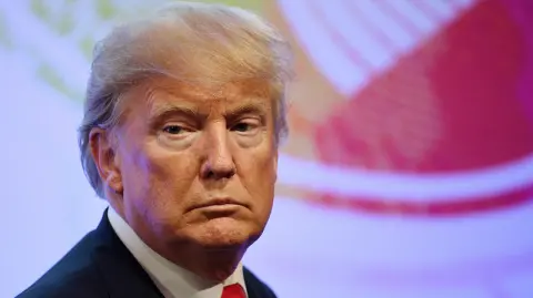 U.S. President Donald Trump arrive for a family photo during the ASEAN-U.S. 40th Anniversary commemorative Summit in Manila, Philippines, Monday, Nov. 13, 2017. (Manan Vatsyayana/Pool Photo via AP) - POOL PHOTO