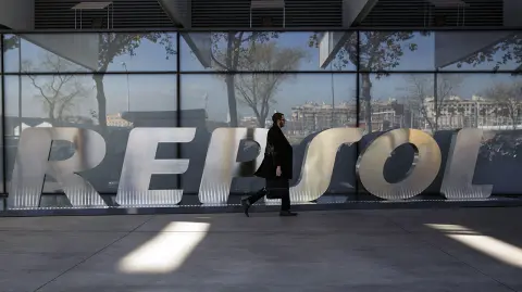 A man walks past the company