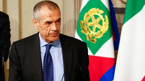 Former senior International Monetary Fund (IMF) official Carlo Cottarelli speaks to the media after a meeting with Italy