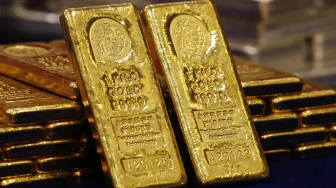 File photo of one-kg 24K gold bars displayed at the Chinese Gold and Silver Exchange Society in Hong Kong - One-kg 24K gold bars are displayed at the Chinese Gold and Silver Exchange Society, Hong Kong