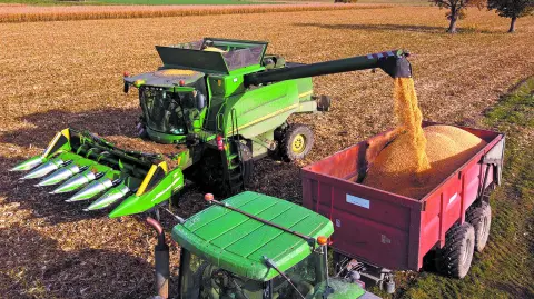 A farmer harvests his field of corn in Guemene-Penfao