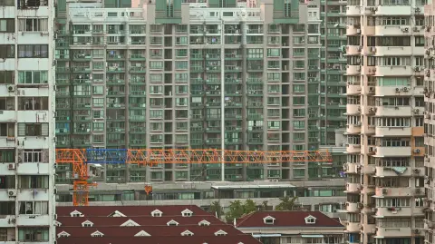 A general view shows buildings in a residential area in the Jing'an district in Shanghai on September 28, 2024. (Photo by Hector RETAMAL / AFP)