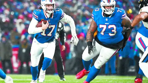 Jan 19, 2025; Orchard Park, New York, USA; Buffalo Bills quarterback Josh Allen (17) runs the ball during the first quarter against the Baltimore Ravens in a 2025 AFC divisional round game at Highmark Stadium. Mandatory Credit: Mark Konezny-Imagn Images