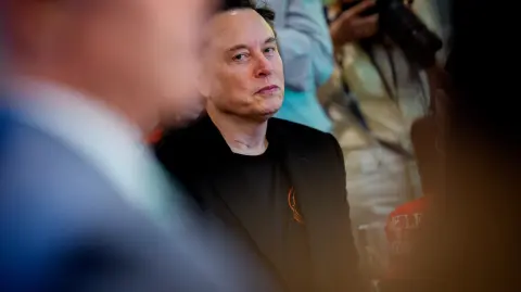 WASHINGTON, DC - APRIL 30: Tesla CEO Elon Musk looks on during a Cabinet meeting at the White House on April 30, 2025 in Washington, DC. Trump convened the meeting as reports released today say the U.S. economy contracted 0.3% in the first quarter of 2025, the first negative reading in three years, fueled by a massive surge in imports ahead of the administration's expected tariffs.   Andrew Harnik/Getty Images/AFP (Photo by Andrew Harnik / GETTY IMAGES NORTH AMERICA / Getty Images via AFP)