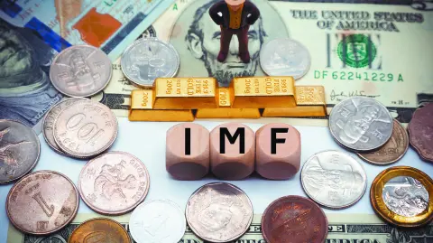 International Monetary Fund (IMF) is an international organization that promotes global economic growth and financial stability, encourages international trade.The word is written on money background