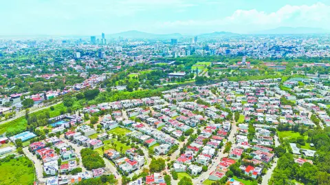 Aerial View of Housing Zone in Guadalajara, Jalisco. Mexico. Skyscrapers in the Background