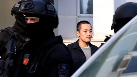 Montenegrin police officers of the PJP (Special Police Unit) escort South Korean cryptocurrency entrepreneur Do Kwon (C) at the exit of a court in Podgorica, Montenegro, on March 23, 2024. A Montenegro appeals court on March 23, 2024, approved the extradition of cryptocurrency entrepreneur Do Kwon to South Korea, where he is wanted over the multi-billion-dollar collapse of the Terra company. (Photo by SAVO PRELEVIC / AFP)