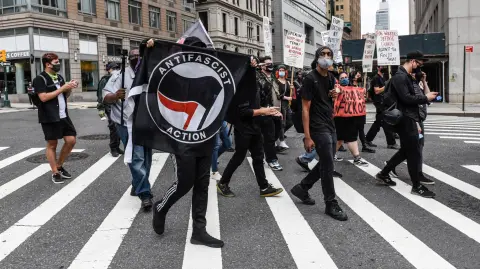NEW YORK, NY - JULY 25: Left wing protesters, some affiliated with Antifa, hold a counter protest against right wing protesters participating in a political rally on July 25, 2021 in New York City. Right wing protesters were demanding a release of the people who were arrested on January 6th for their involvement in the breach of the Capitol building.   Stephanie Keith/Getty Images/AFP (Photo by STEPHANIE KEITH / GETTY IMAGES NORTH AMERICA / Getty Images via AFP)
