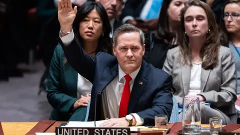 NEW YORK, NEW YORK - NOVEMBER 17: U.S. Ambassador to the United Nations Mike Waltz raises his hand to vote in favor of a draft resolution to authorize an International Stabilization Force in Gaza, on November 17, 2025 in New York City. The United Nations Security Council is voting on a draft resolution authored by the US that welcomes the establishment of a Board of Peace (BoP) as a "transitional governance administration" in Gaza and authorizes the BoP to establish a temporary International Stabilization Force (ISF) in the region.   Adam Gray/Getty Images/AFP (Photo by Adam Gray / GETTY IMAGES NORTH AMERICA / Getty Images via AFP)
