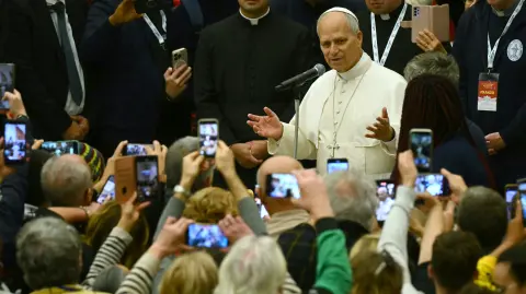 Pope Leo XIV attends a lunch organised on the World Day of the Poor at the Paul VI audience hall in The Vatican, on November 16, 2025. (Photo by Filippo MONTEFORTE / AFP)
