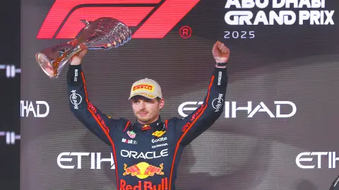 Red Bull's Max Verstappen celebrates with a trophy on the podium after winning the Abu Dhabi Grand Prix REUTERS/Amr Alfiky