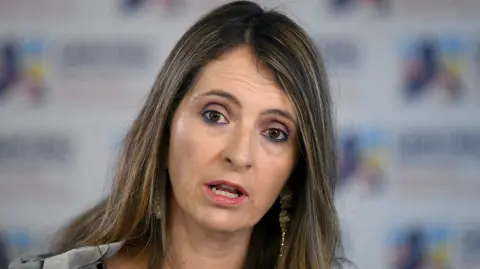 Colombian opposition senator Paloma Valencia delivers a speech a day after the inauguration of leftist Gustavo Petro as President in Bogota, on August 8, 2022. Gustavo Petro, the first left-wing president in Colombia's history, was sworn in on Sunday in front of hundreds of thousands of people in Bogota, calling on armed groups to sign peace and end the "war against drugs". (Photo by DANIEL MUNOZ / AFP)