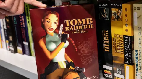 This photograph taken on August 4, 2022 shows the video game Tomb Raider II belonging to the Charles Cros collection exposed at the Francois-Mitterrand National Library of France in Paris. (Photo by BERTRAND GUAY / AFP)