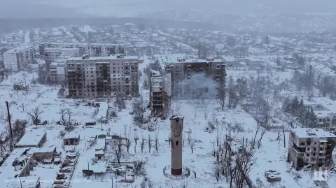 This handout photograph, taken on December 29, 2025, and released by the press service of the 116th Separate Mechanized Brigade of the Ukrainian Ground Forces on December 30, shows an aerial view of heavily damaged residential buildings in the frontline town of Kupiansk, Kharkiv region, amid the Russian invasion of Ukraine. (Photo by Handout / 116th Separate Mechanized Brigade of the Ukrainian Ground Forces / AFP) / XGTY / RESTRICTED TO EDITORIAL USE - MANDATORY CREDIT "AFP PHOTO / 116TH SEPARATE MECHANIZED BRIGADE OF THE UKRAINIAN GROUND FORCES" - NO MARKETING NO ADVERTISING CAMPAIGNS - DISTRIBUTED AS A SERVICE TO CLIENTS