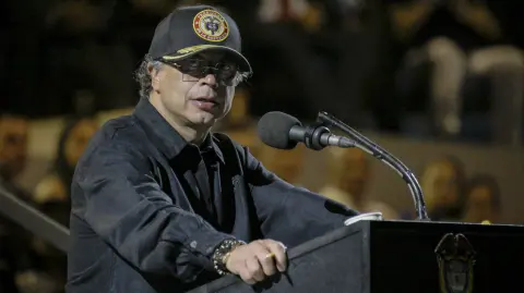 (FILES) Colombia's President Gustavo Petro speaks during a promotion ceremony at the Marco Fidel Suarez Air Force base in Cali, Colombia on December 4, 2025. Colombian President Gustavo Petro said on December 30, 2025, that the United States bombed a cocaine factory in the Venezuelan city of Maracaibo, which he linked to the Colombian guerrilla group ELN. (Photo by JOAQUIN SARMIENTO / AFP)