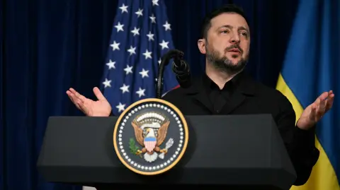 Ukranian President Volodymyr Zelensky speaks during a press conference with US President Donald Trump following talks at Trump's Mar-a-Lago residence in Palm Beach, Florida, on December 28, 2025. (Photo by Jim WATSON / AFP)