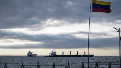 This view shows the bulk carrier Ithaca Patience (R) and the crude oil tanker Nord Star, both from Panama, anchored on Lake Maracaibo, Venezuela on January 7, 2026. US Energy Secretary Chris Wright said in January 7, Washington will control sales of Venezuelan oil "indefinitely," a day after President Donald Trump announced Venezuela's interim leaders had agreed to US-managed marketing of 30-50 million barrels of crude. (Photo by Maryorin Mendez / AFP)
