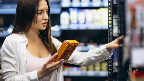 Woman shopping food at grocery store
