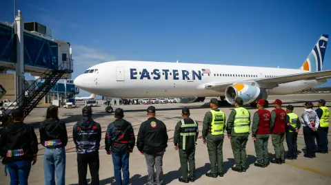 A plane carrying Venezuelan migrants deported from the United States upon arrival at Simon Bolivar International Airport, in Maiquetia, Venezuela, January 16, 2026. REUTERS/Leonardo Fernandez Viloria