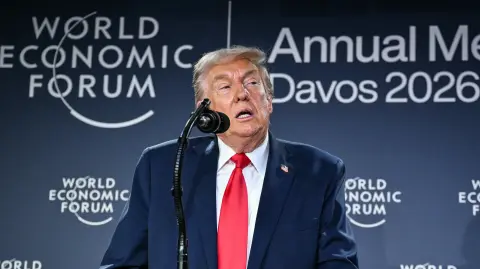 US President Donald Trump speaks during a reception with business leaders on the sidelines of the World Economic Forum (WEF) annual meeting in Davos on January 21, 2026. The World Economic Forum takes place in Davos from January 19 to January 23, 2026. (Photo by Mandel NGAN / AFP)
