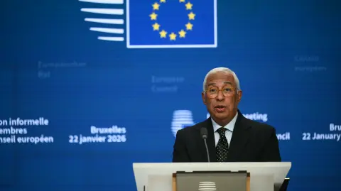European Council President Antonio Costa delivers a speech for a closing press conference after an emergency meeting of the European Council over US President's Greenland threats, at the European headquarters in Brussels, on January 22, 2026. EU leaders meet on January 22, 2026, for an emergency summit on threats by US President to impose tariffs on countries opposed to his push to take Greenland, with crisis talks in Brussels coming to weigh potential countermeasures against the United States. (Photo by NICOLAS TUCAT / AFP)