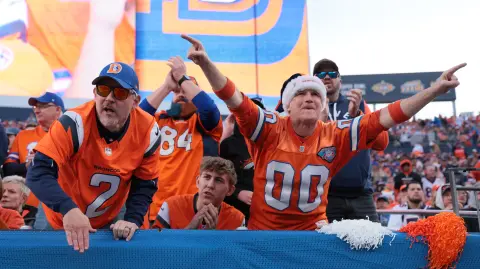 DENVER, COLORADO - JANUARY 04: Denver Broncos fans attend the game against the Los Angeles Chargers at Empower Field At Mile High on January 04, 2026 in Denver, Colorado.   C. Morgan Engel/Getty Images/AFP (Photo by C. Morgan Engel / GETTY IMAGES NORTH AMERICA / Getty Images via AFP)
