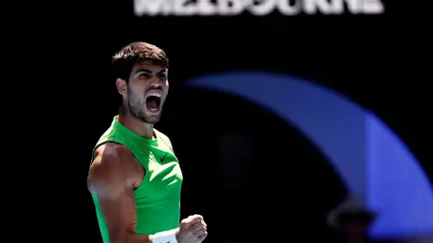 Tennis - Australian Open - Melbourne Park, Melbourne, Australia - January 25, 2026 Spain's Carlos Alcaraz reacts during his fourth round match against Tommy Paul of the U.S. REUTERS/Tingshu Wang     TPX IMAGES OF THE DAY