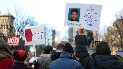 People hold a photo of Liam Conejo Ramos, a five-year-old boy who was held by immigration officers, during an "ICE Out" protest in New York on January 23, 2026 against US Immigration and Customs Enforcement (ICE). Demonstrations against ICE grew dramatically following the killing of Renee Nicole Good, 37, by an ICE officer in Minneapolis on January 7 as the Trump administration pressed operations to catch undocumented migrants. (Photo by ANGELA WEISS / AFP)