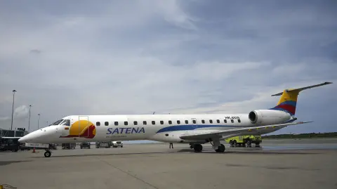 (FILES) A Satena Airlines aircraft covering the route Bogota-Caracas is pictured upon arrival at Simon Bolivar International Airport in Maiquetia, La Guaira State, Venezuela, on November 9, 2022. A commercial plane with 15 people on board disappeared in Colombia near the border with Venezuela, the state-owned airline Satena reported on January 28, 2025. (Photo by Federico PARRA / AFP)