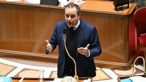 France's Prime Minister Sebastien Lecornu gestures as he speaks during a debate on no-confidence motions against the 2026 finance bill, which was adopted without a vote after the government triggered Article 49.3 of the Constitution, at the National Assembly in Paris on February 2, 2026. (Photo by Bertrand GUAY / AFP)