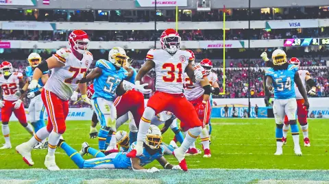 Nov 18, 2019; Mexico City, MEX; Kansas City Chiefs running back Darrel Williams (31) celebrates after scoring on a 6-yard touchdown run in the third quarter against the Los Angeles Chargersduring an NFL International Series game at Estadio Azteca. Mandatory Credit: Kirby Lee-USA TODAY Sports
