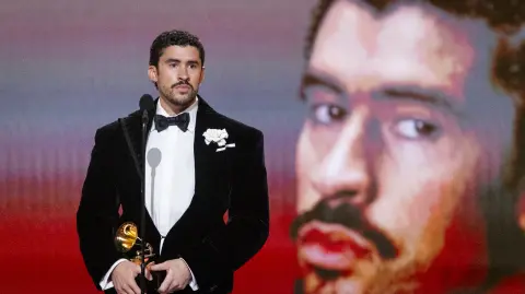 LOS ANGELES, CALIFORNIA - FEBRUARY 01: Bad Bunny accepts the Album of the Year award for "DeBÍ TiRAR MáS FOToS" onstage during the 68th GRAMMY Awards at Crypto.com Arena on February 01, 2026 in Los Angeles, California.   Emma McIntyre/Getty Images for The Recording Academy/AFP (Photo by Emma McIntyre / GETTY IMAGES NORTH AMERICA / Getty Images via AFP)