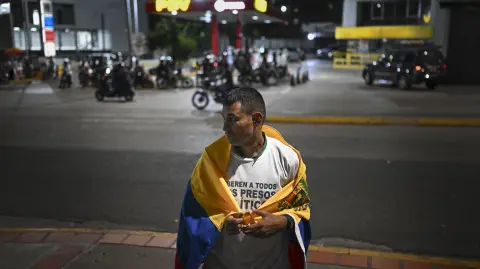 Former political prisoner Guillermo Lopez attends a demonstration demanding the release of detainees outside the El Helicoide building, headquarters of the Bolivarian National Intelligence Service (SEBIN), in Caracas on February 1, 2026. (Photo by Federico PARRA / AFP)