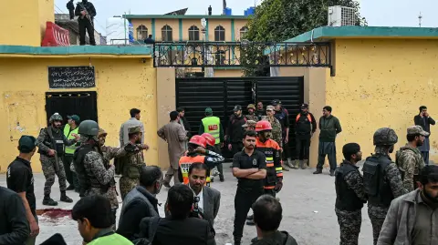 Security personnel stand guard outside a mosque following an explosion, in Islamabad on February 6, 2026. A blast at a Shiite mosque in Pakistan's capital Islamabad on February 6 killed 15 people and wounded at least 80, local authorities said. (Photo by Farooq NAEEM / AFP)