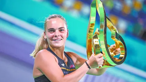 Czech Republic's Sara Bejlek celebrates with the winning trophy after defeating Russiaís Ekaterina Alexandrova during their womenís singles final match at the Abu Dhabi Open tennis tournament in Abu Dhabi on February 7, 2026. (Photo by Fadel SENNA / AFP)