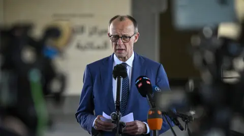 German Chancellor Friedrich Merz speaks at a press conference in Doha on February 5, 2026. Merz arrived for a Gulf tour on February 4,as the biggest EU economy seeks to diversify its key trade and energy partnerships. (Photo by Mahmud HAMS / AFP)