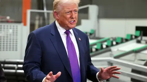 US President Donald Trump speaks to reporters as he tours the Coosa Steel Corporation factory in Rome, Georgia, on February 19, 2026. (Photo by SAUL LOEB / AFP)