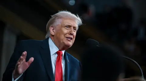 US President Donald Trump delivers the first State of the Union address of his second term to a joint session of Congress in the House Chamber of the United States Capitol in Washington, DC, on February 24, 2026. (Photo by Kenny HOLSTON / POOL / AFP)