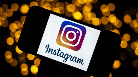 This picture taken on September 28, 2020 shows the logo of the social network Instagram on a smartphone, in Toulouse, southwestern France. The Instagram group will, in early October 2020, celebrate its ten-year anniversary. (Photo by Lionel BONAVENTURE / AFP)