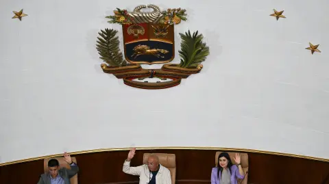Venezuela's National Assembly President Jorge Rodriguez (C) speaks next to First Vice President Pedro Infante (L), and Second Vice President America Perez during the first session of a new mining law debate at the National Assembly in Caracas on March 9, 2026. Venezuela begins debate on a new mining law on Marc 9, 2026, that seeks to attract foreign capital, amid renewed relations with the US following the fall of Nicolas Maduro. (Photo by Juan BARRETO / AFP)