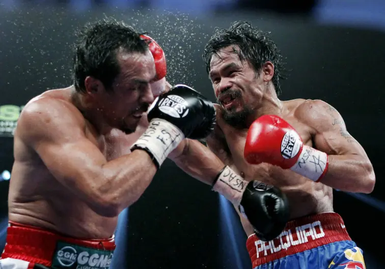 Pacquiao gana cerrado combate y retiene ante Márquez