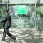 A man walks past a BNP Paribas bank office in Madrid