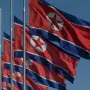 North Korean flags fly at half-mast in solidarity with Cuba following the death of Fidel Castro, in Pyongyang on November 28, 2016. (Photo by Ed JONES / AFP)